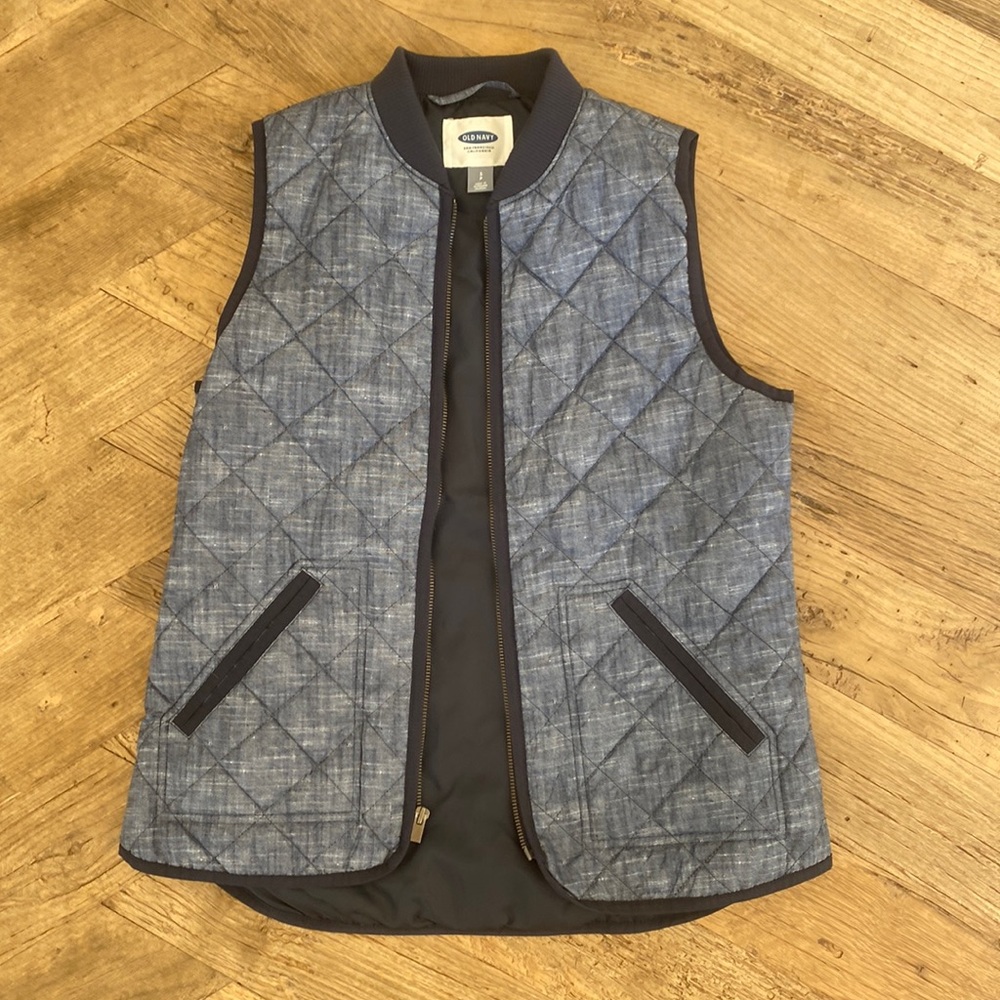 Thin puffer vest, denim color, light weight and goes with everything.